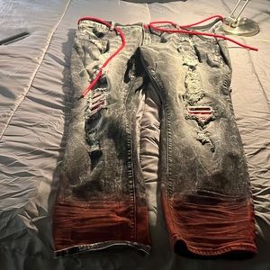 Gently worn distressed black and red jeans